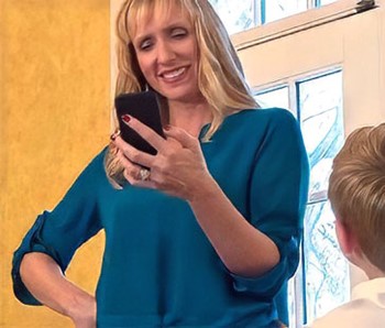 Woman checks status of elder on phone
